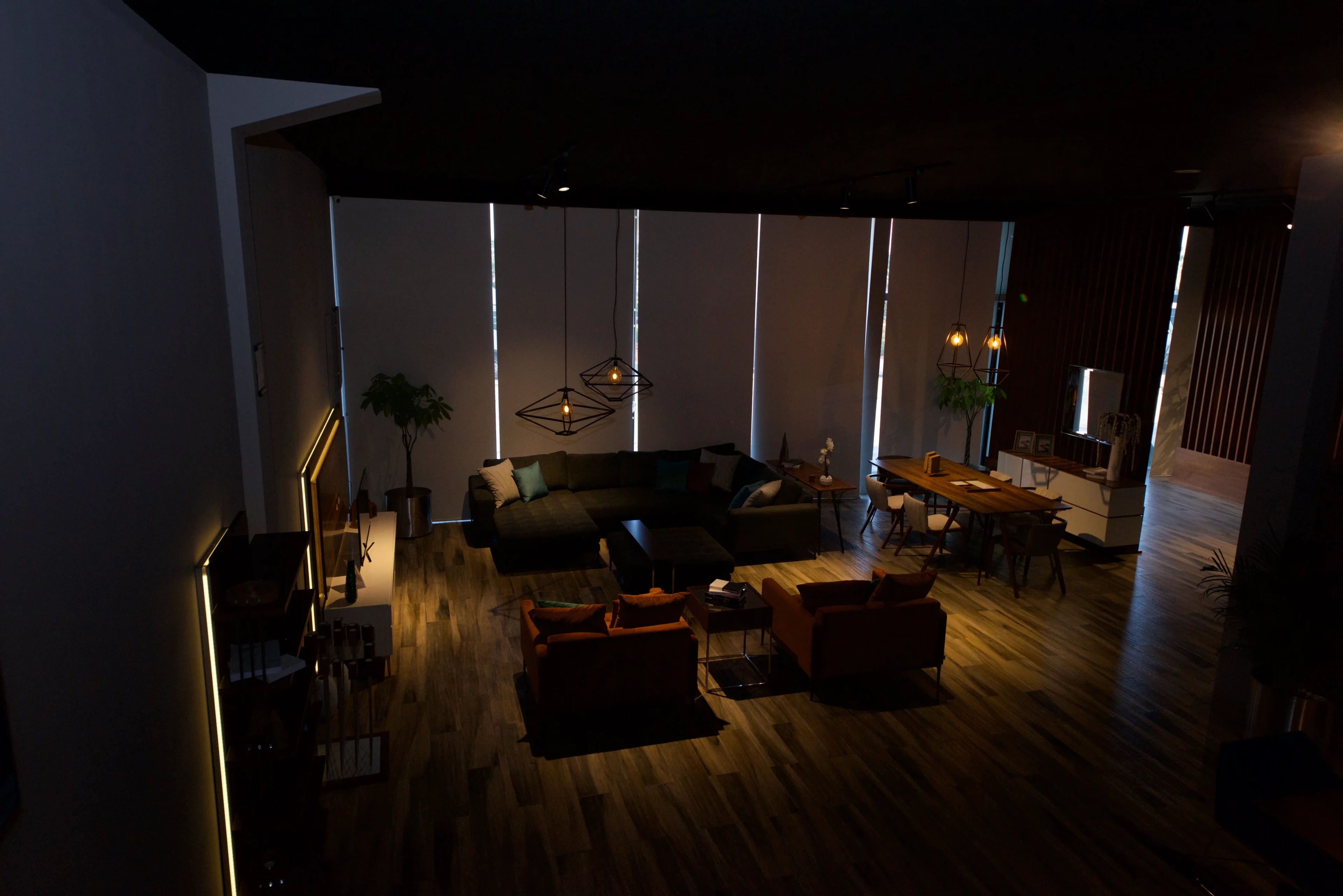 A living room with many couches and lamps